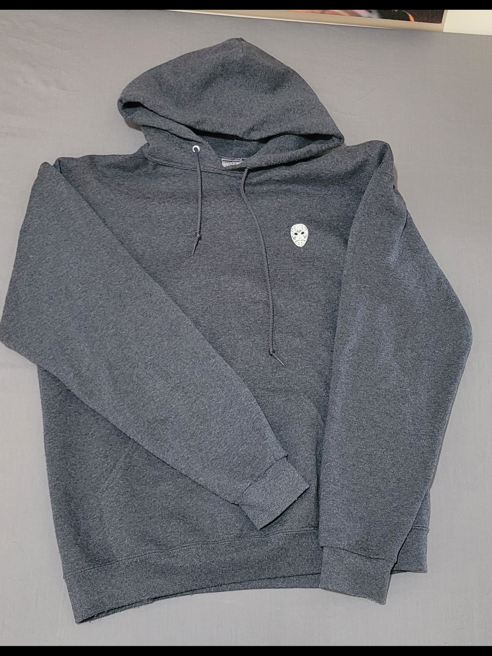 Jerzees Dark Gray Pullover Hoodie with Small White Mask Graphic